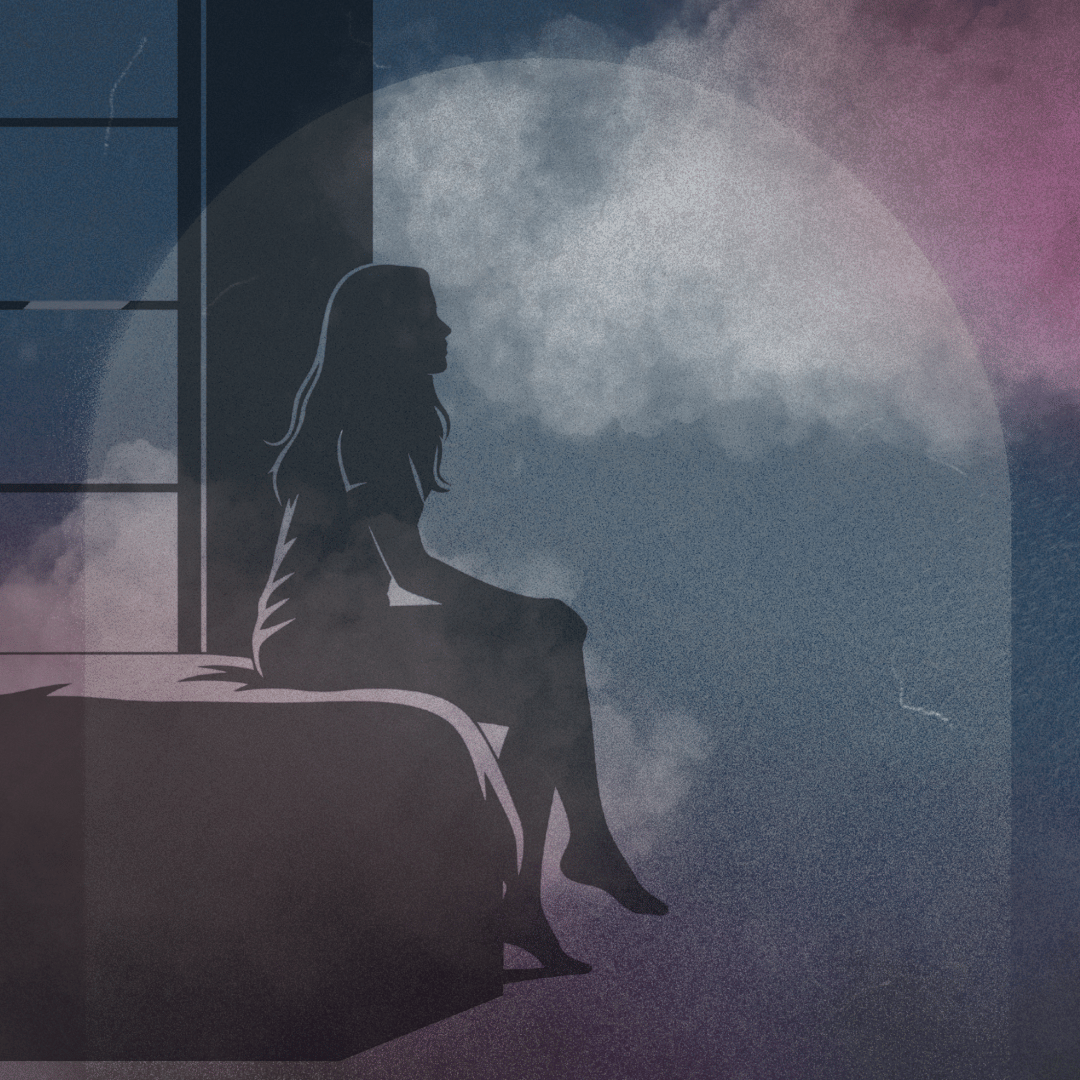 person sitting on bed