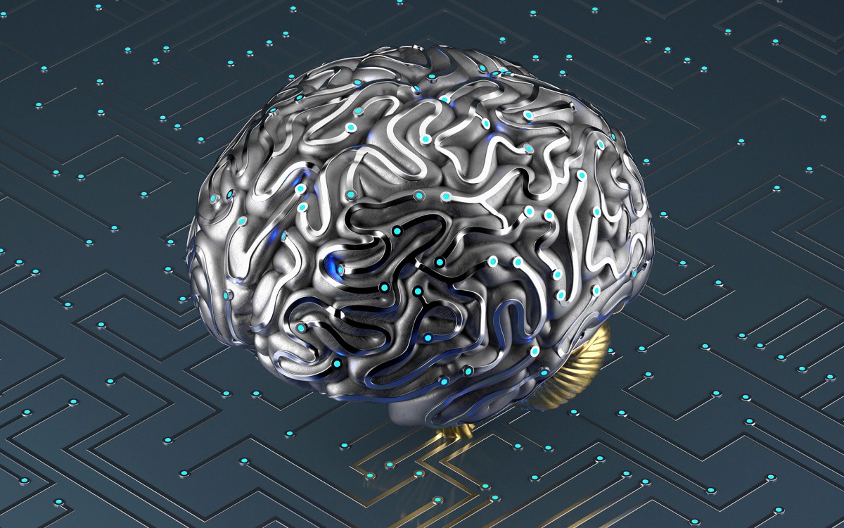 Artificial brain connected to circuit board.