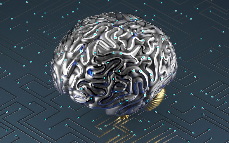 Artificial brain connected to circuit board.
