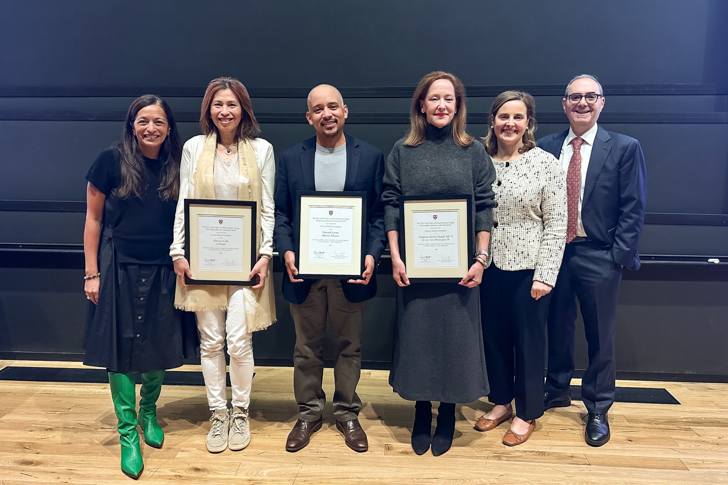 Six people pose for a group photo at the Harvard Alumni Association (HAA) Clubs and Shared Interest Groups (SIGs) Awards ceremony. Three award recipients hold framed certificates.